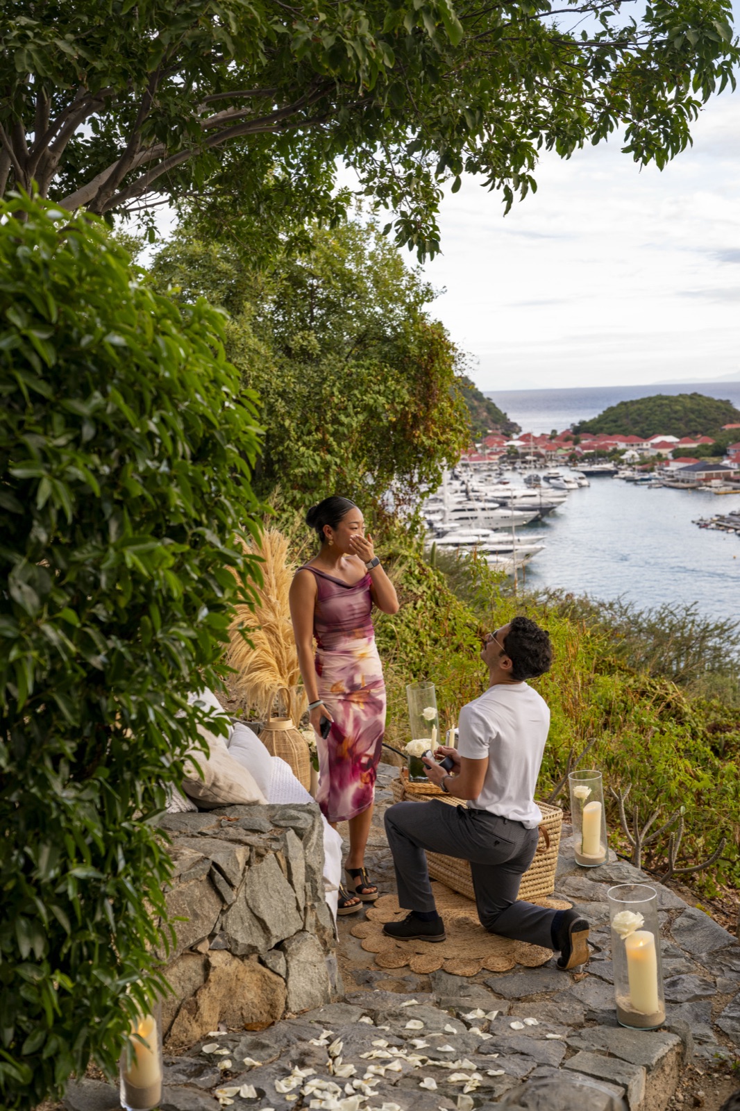 George proposing to Fuanne on a hillside overlooking the harbor