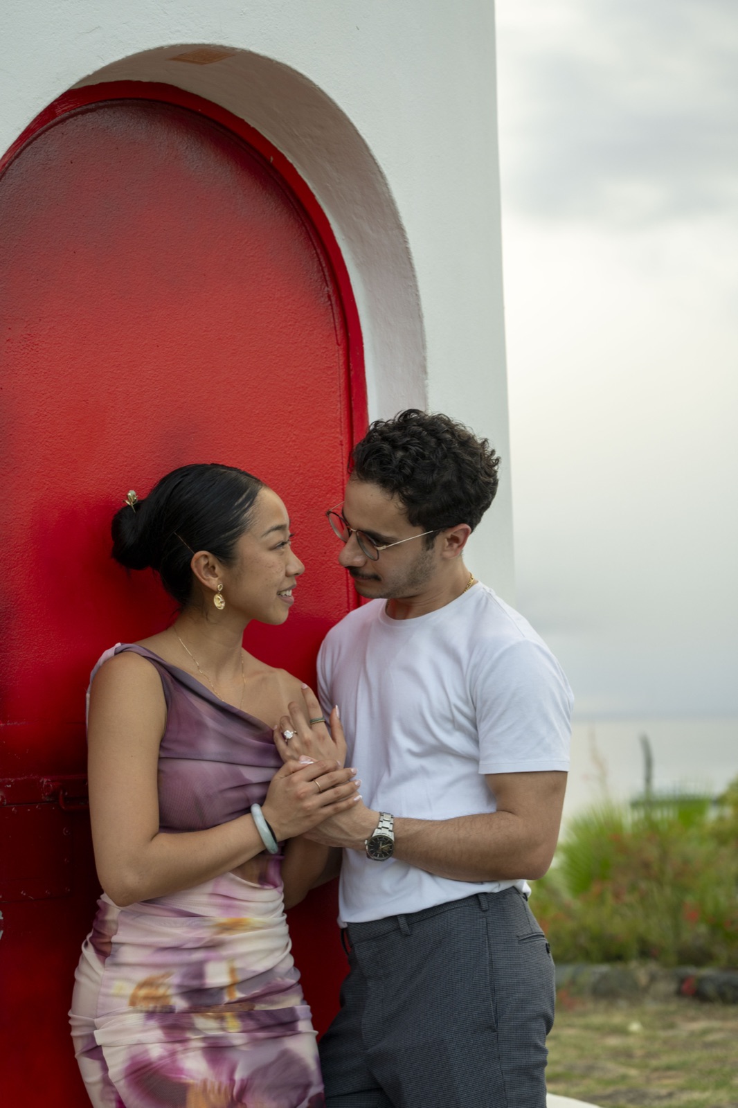Fuanne and George together at a red door
