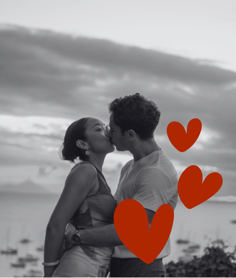 Fuanne and George kissing by the sea